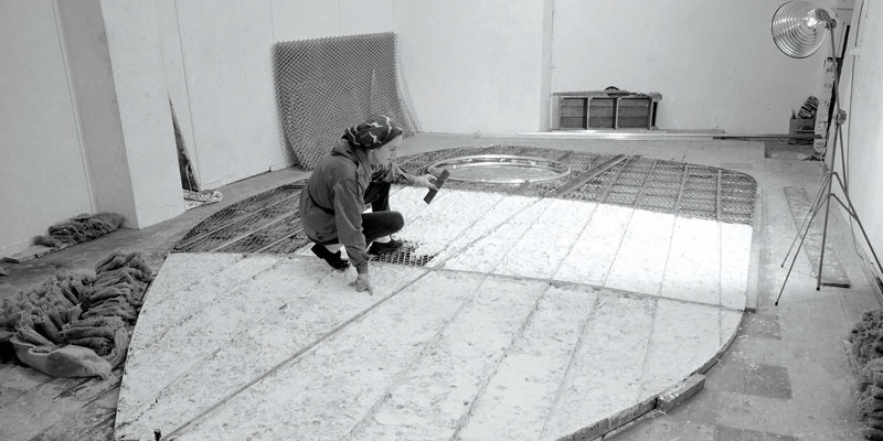 Barbara Hepworth working on the armature of Single Form in the Palais de Danse, St Ives, 1961. Photograph by Studio St Ives. Barbara Hepworth 漏 Bowness